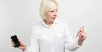 older woman with two phones